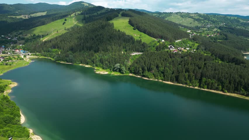 Beautiful mountain lake in Romania seen from above. Lake Bicaz and the Carpathians showing stunning nature and calm scenery.