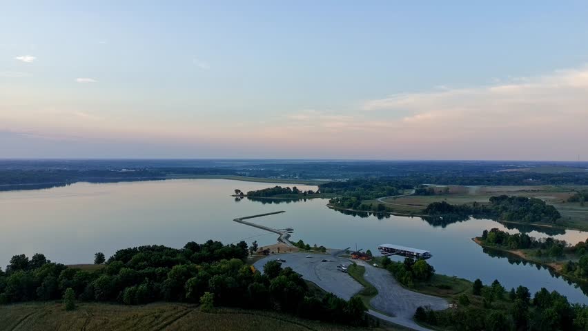 Sunrise over a lake in Missouri on a warm autumn day, calm water
