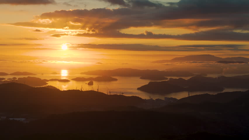 Cinematic aerial shot of sunrise at Seto inland sea in Hiroshima prefecture, Japan