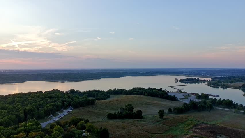 Sunrise over a lake in Missouri on a warm autumn day, calm water