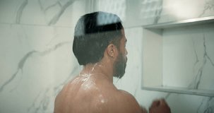 Man, shower and grooming in bathroom for cleaning, wellness and washing hair in home. Male person, house and running water in morning for skincare, splash and fresh body with cosmetics and shampoo - Powered by Shutterstock - Get 15% off with code: PIKWIZARD15