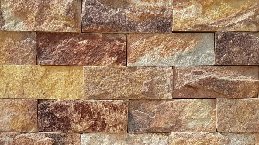 An old fashion bricks wall with grainy texture in a vintage style and pattern