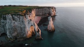 Discover the beauty of Étretat in 4K. Drone footage of white chalk cliffs, sea arches, and dramatic Normandy coastline views. - Powered by Shutterstock - Get 15% off with code: PIKWIZARD15