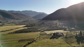 Drone flying above amazing countryside field with olive trees plantation, aerial view shot of morning sunrise rural village with beautiful rolling hills covered with mist, panoramic landscape of - Powered by Shutterstock - Get 15% off with code: PIKWIZARD15