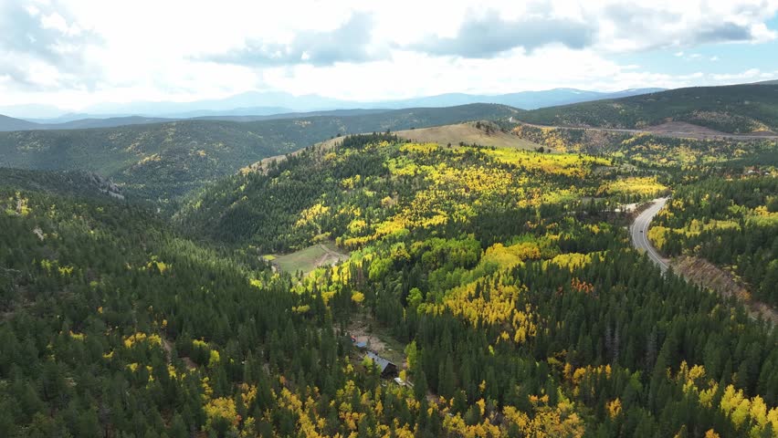 Colorado mountain road with epic mountain backdrop tourism in the rockies