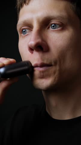 Close up electric shaver grooming with copy space, man beauty and skincare commercial concept. Vertical Video