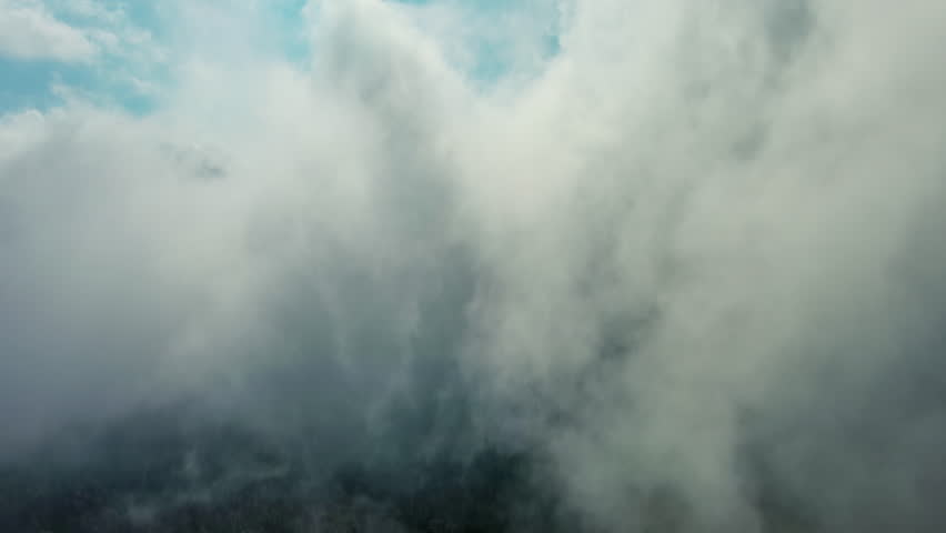 Aerial high view of clouds and blue sky, flying in clouds, 4k
