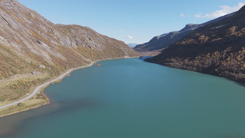 Turquoise green glacier lake in Jotunheimen National Park, Norway. Drone footage
