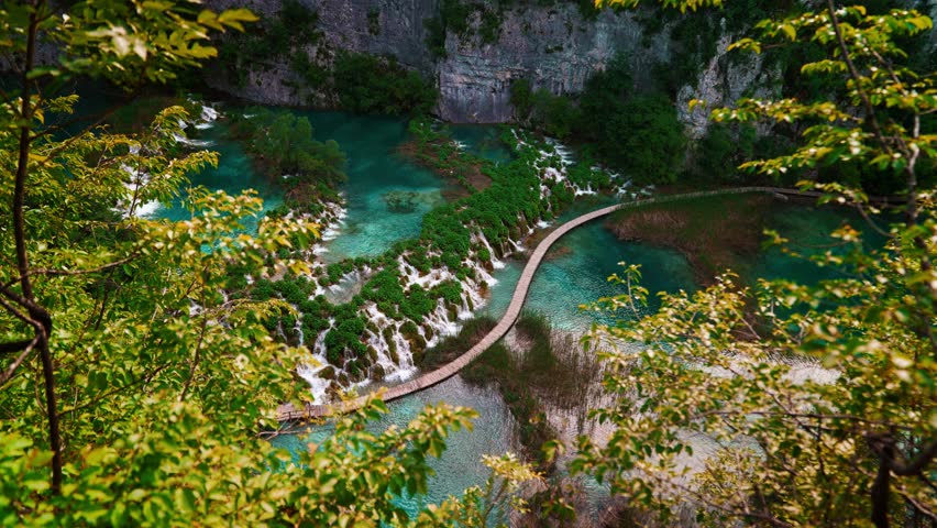Calm and clear turquoise pools with flowing waterfalls in Plitvice Lakes National Park, Croatia