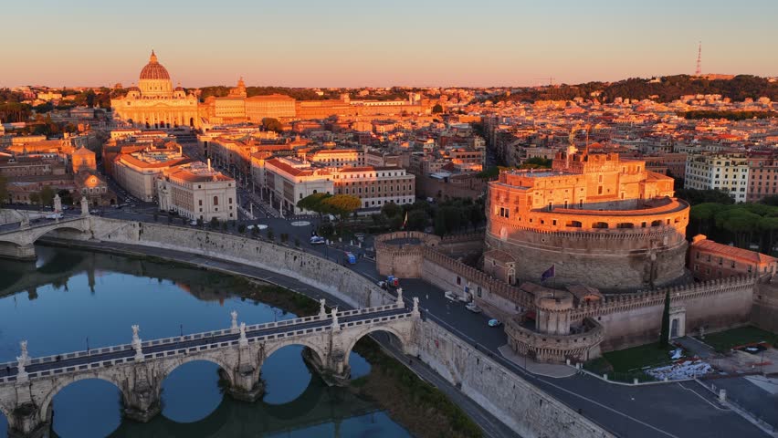 aerial view of Rome at sunrise, historic ancient Roman architecture, Sant Angelo castle and Tiber river with Sant Angelo bridge, drone shot, holidays in Rome, capital of Italy