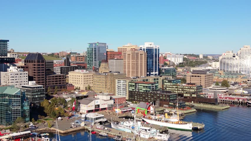 Aerial View Of Modern Halifax Business District With High-Rise Skyscrapers, Luxurious Yachts Docked At The Marina, And Sparkling Waterfront Promenade In Nova Scotia, Canada. Captured On A Sunny 