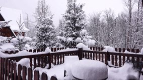 wooden house and falling snow create a beautiful winter landscape. Tatra Mountains, Zakopane, Poland - Powered by Shutterstock - Get 15% off with code: PIKWIZARD15