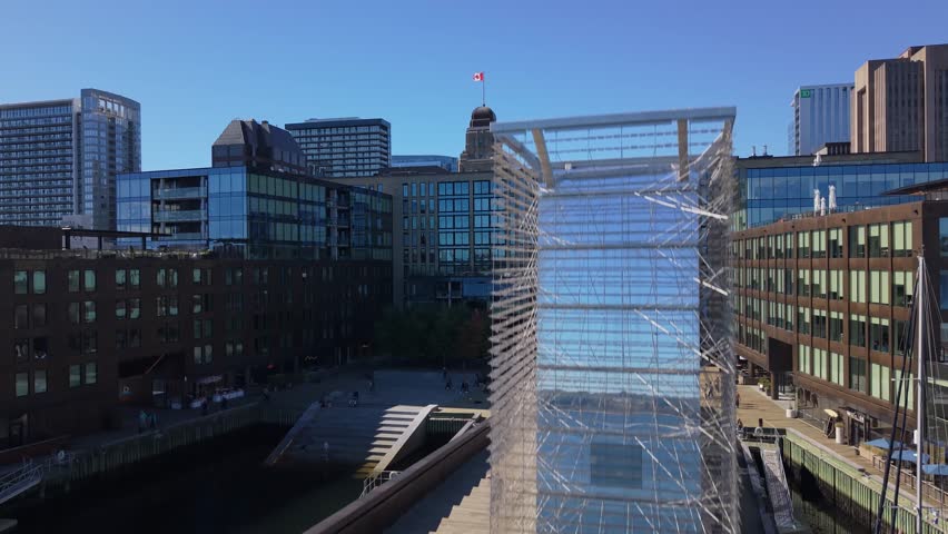 Skyscrapers Cast Long Shadows Over The Calm Harbor Where Dozens Of White Boats Are Docked. Captured At Sunrise In Halifax, Nova Scotia, This Scene Reflects Autumn Tranquility And Urban Charm.