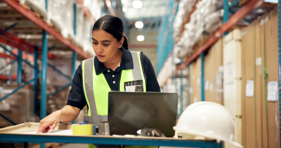 Laptop, logistics and reading with woman in warehouse for delivery information, shipping and cargo. Supply chain industry, digital inventory and ecommerce inspection with person for factory storage