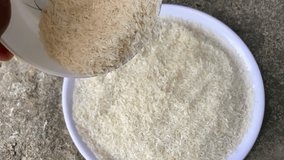 Slow Motion of Rice Falling from Bowl | Close-Up of Uncooked Grains Pouring - Powered by Shutterstock - Get 15% off with code: PIKWIZARD15