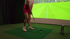 Indoor golf practice session focusing on swing technique and alignment - Powered by Shutterstock - Get 15% off with code: PIKWIZARD15