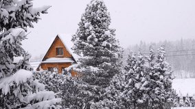 wooden house and falling snow create a beautiful winter landscape. Tatra Mountains, Zakopane, Poland - Powered by Shutterstock - Get 15% off with code: PIKWIZARD15