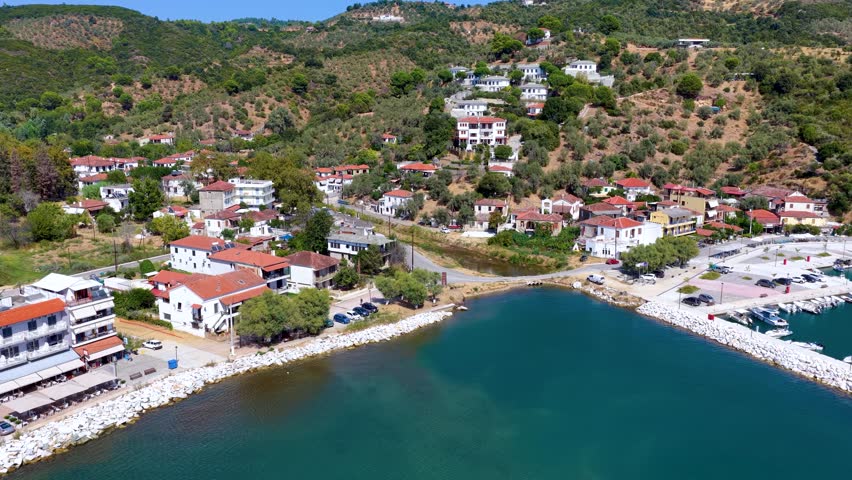 Aerial view of the fishing village Platanias, South Pelion, Greece, with marina and traditional, red roofed houses