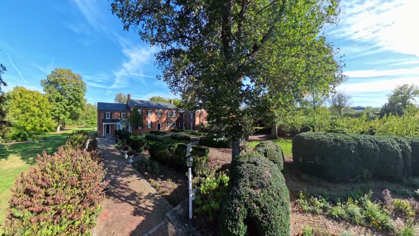 Discover the stunning outdoor views of the Shenandoah Gardens and museum in Winchester, Virginia. Enjoy the lush landscapes and historic architecture.