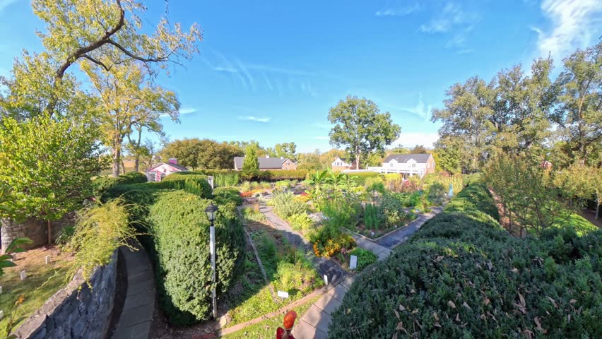 Discover the scenic outdoor views of the Shenandoah Gardens in Winchester, Virginia. Enjoy the lush greenery and charming surroundings on a sunny summer day.