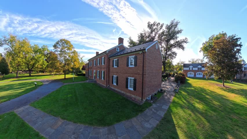 Discover the beautiful outdoor views of Shenandoah Gardens and the historic museum in Winchester, Virginia, on a sunny summer day.