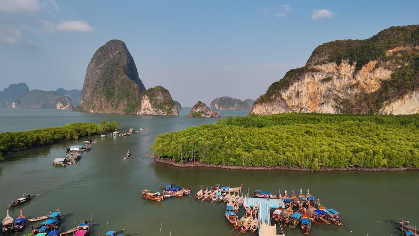Aerial view of phang nga bay, Phuket, Thailand, longtail boats, Green mangrove forest ecosystem, towering limestone cliffs
