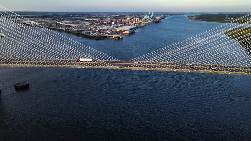 Aerial view of modern bridge design in Jacksonville. Dramatic clouds paint the perfect backdrop.
