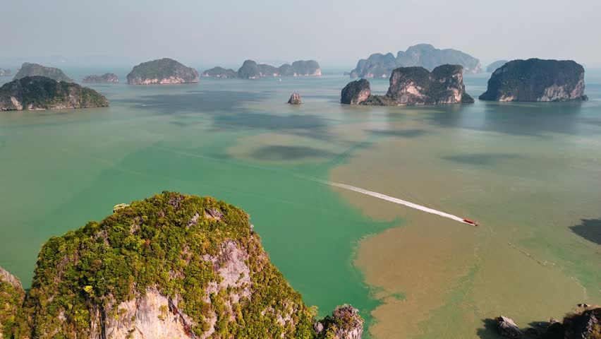 Aerial view of phang nga bay, Thailand, turquoise waters, and iconic limestone karsts