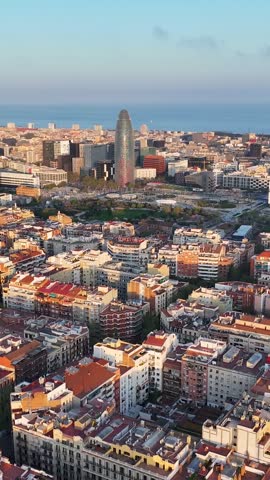 Sunset Over Glories Tower At Barcelona In Community Of Catalonia Spain. Medieval Buildings. Downtown Cityscape. Barcelona At Community Of Catalonia Spain. Sunset Skyline. Rays Of Sun Scene.