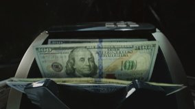 Money counting machine bank machine close up. 100 American dollar bills. Business finance, cash. Seller, broker considers the client's finances. Economic crisis in USA. Paper banknote. Wide angle lens - Powered by Shutterstock - Get 15% off with code: PIKWIZARD15
