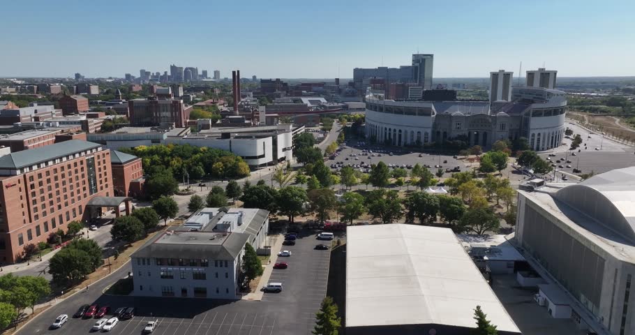 Columbus, United States - 14 September 2025: Aerial view of St. John Arena and the iconic Ohio Stadium bathed in soft sunlight, revealing the city skyline.