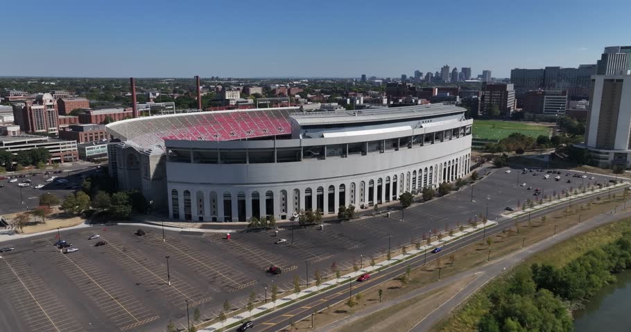 Columbus, United States - 14 September 2025: Aerial view of the iconic Ohio Stadium with its distinctive arches and vibrant red accents, next to the Olentangy River.