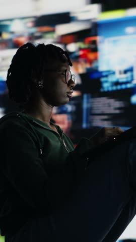 Vertical video Teenager procrastinating online, browsing websites on laptop instead of doing school assignments. Lazy woman using notebook to have fun on internet instead of doing chores, camera B