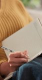 Writing, hands or woman in home with journal for planning goals, creative idea or inspiration. Daily reflection, notes or female person in house with diary for self improvement, thoughts or insight. - Powered by Shutterstock - Get 15% off with code: PIKWIZARD15