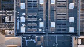 Modern data center building roof with telecommunication antennas, HVAC units, server facility, Warsaw, Revealing drone shot - Powered by Shutterstock - Get 15% off with code: PIKWIZARD15