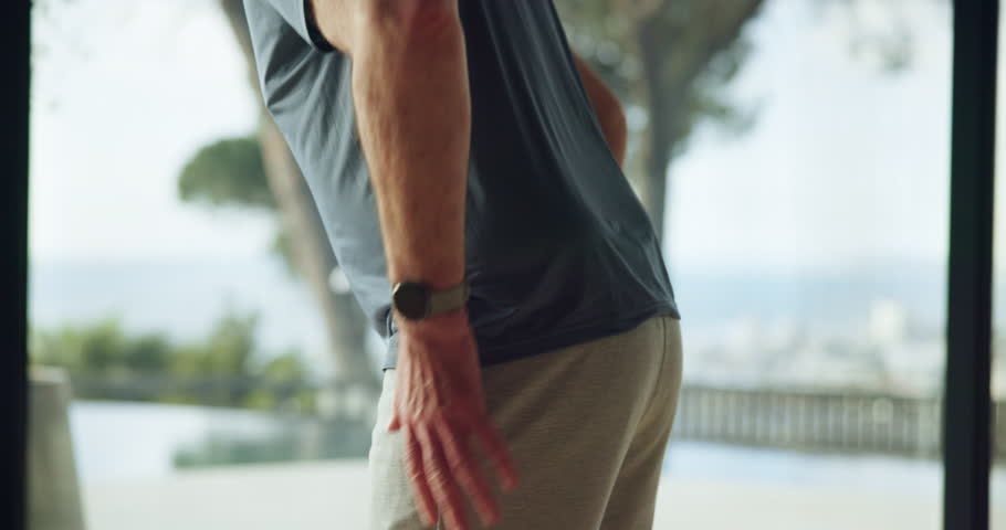 Hands, man and back injury in fitness with muscle tension, workout accident and inflammation in home. Wellness, person and spine fracture in house from herniated disc, joint ache and training sprain