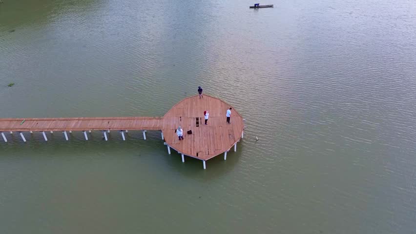 Aerial View of People on Dock by Lake