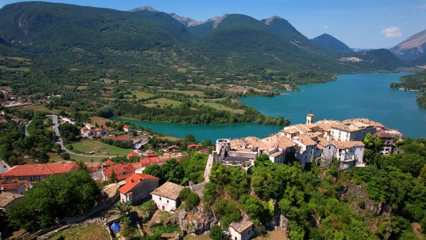 Italy tourism. Medeival scenic Barrea village and lake in Sangro Valle. National Park of Abruzzo and Molise. 4k hd drone footage. Italian scenery and most beautiful villages