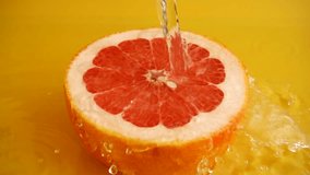 Refreshing grapefruit slice with water cascading down on juicy fruit surface - Powered by Shutterstock - Get 15% off with code: PIKWIZARD15