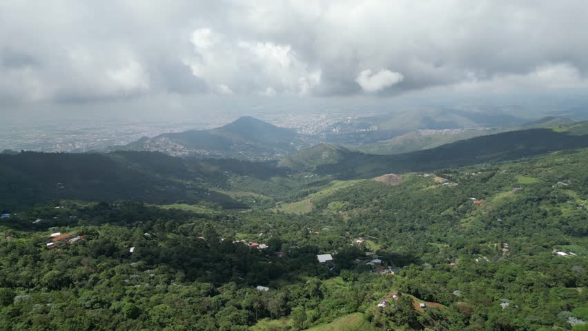 Aerial view of the lush hills of La Paz in the outskirts of Cali in the Valle del Cauca Department of Colombia, showing rural landscapes and panoramic views of the city in the background