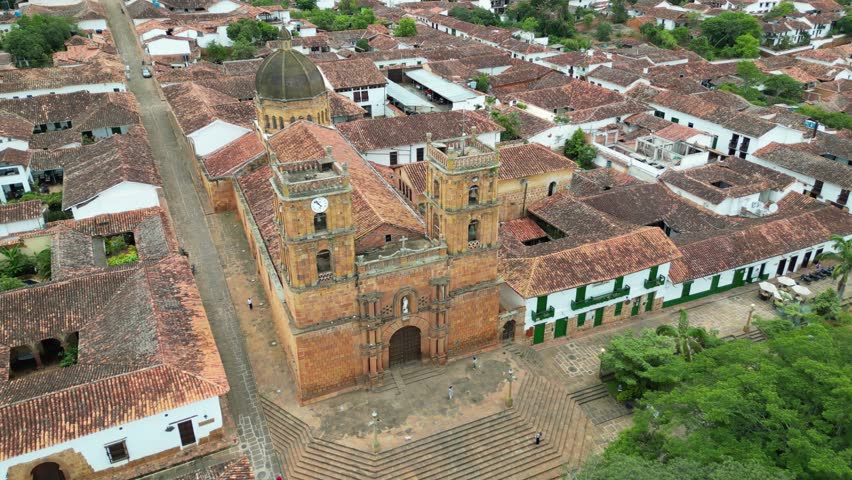 Aerial view of the Parish Church of the Immaculate Conception in the Andean village of Barichara in the Santander Department of Colombia, surrounded by colonial clay houses with red-tiled roofs