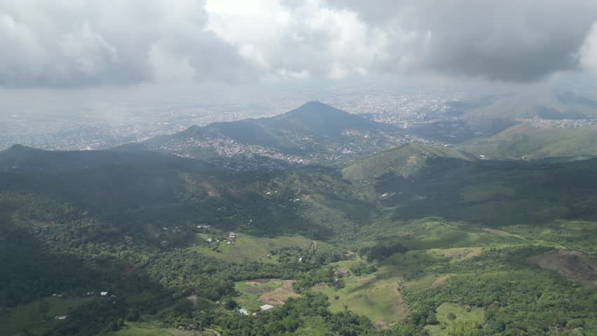 Aerial view of the lush hills of La Paz in the outskirts of Cali in the Valle del Cauca Department in Colombia, showing rural landscapes and panoramic views of the city in the background