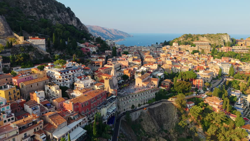 Colorful Italian village of Taormina on a cliff. Aerial view