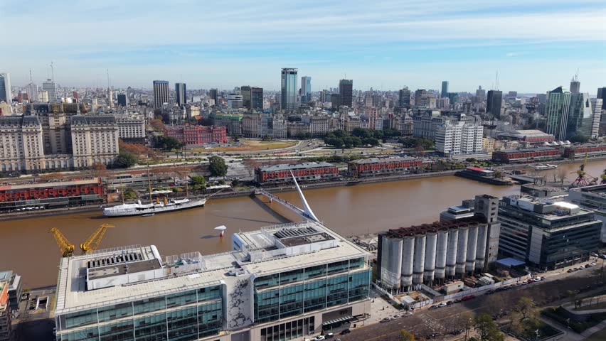 Aerial view of Puerto Madero waterfront and iconic bridge in Buenos Aires Argentina, modern architecture and tourism