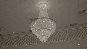 Large Crystal Chandelier in Elegant Ballroom, Low Angle View, Luxurious Interior Design - Powered by Shutterstock - Get 15% off with code: PIKWIZARD15