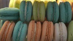 A vibrant close-up shot of an assortment of colorful French macarons, showcasing their delicate texture and beautiful pastel colors. Perfect for food blogs, pastry shop advertisements, and culinary - Powered by Shutterstock - Get 15% off with code: PIKWIZARD15