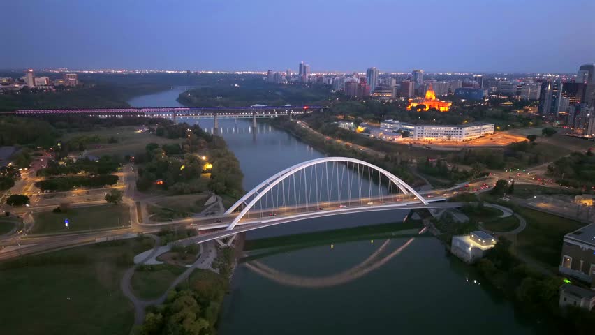 Panoramic aerial sunrise view of downtown Edmonton skyline, Walterdale Bridge, and Alberta Legislature, Alberta, Canada