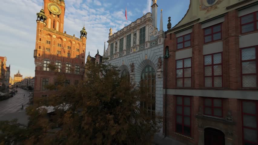 Unusual FPV aerial shot of Gdansk Long Market with Main Town Hall. Poland
