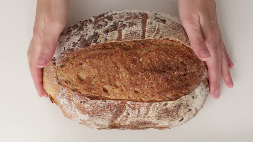 homemade sourdough grain bread texture in hands zoom