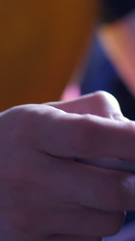 Close Up Of A Hand On A Grey Game Controller. Slider Shot. Vertical.